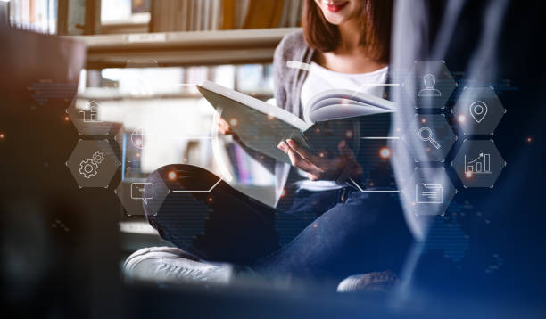 istock Asian woman student college opening and reading a book at library.library.Education, Learning, Student, Campus, University, Lifestyle concept. 1492405876