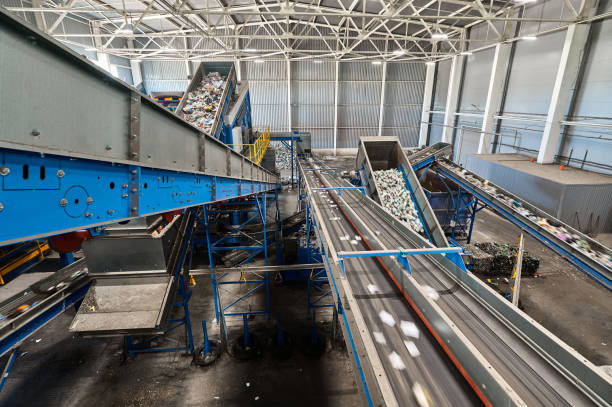Conveyor belt transports sorted litter at recycling plant stock photo