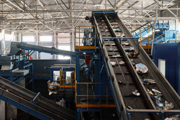 istock Rubbish on conveyor belt in recycling plant workshop 1492409093