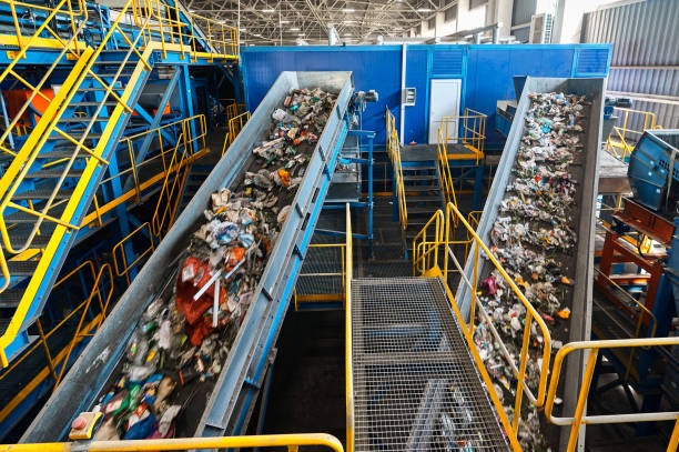 istock Trash transported by conveyor in recycling plant workshop 1492409120