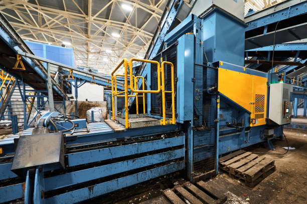 istock Machine for compacting household waste. Compaction of garbage into briquettes and bales. 1492409142