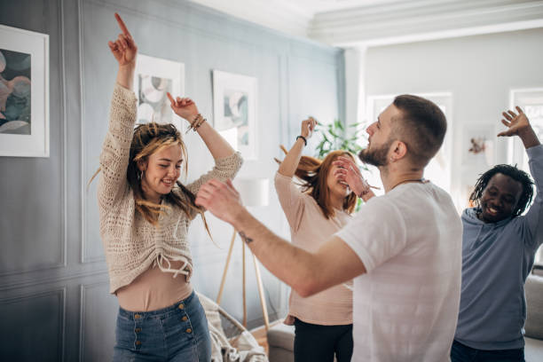 istock Happy friends dancing at home 1492409849