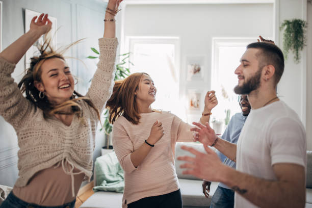 istock Friends dancing at home 1492410434