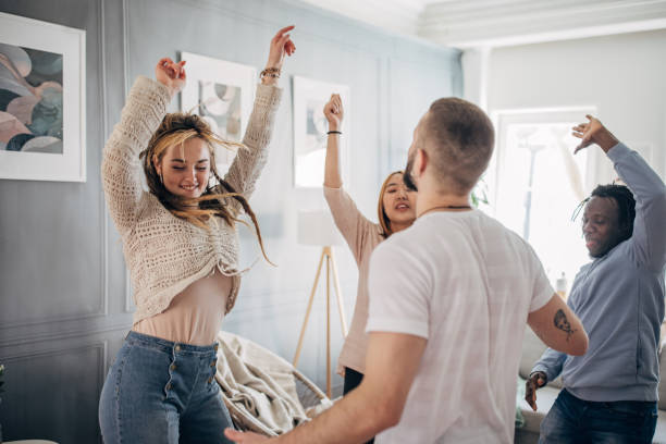 istock Friends dancing at home 1492410981