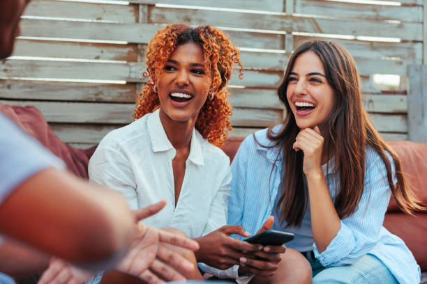 istock Two multiracial young woman laughing together. 1492411723