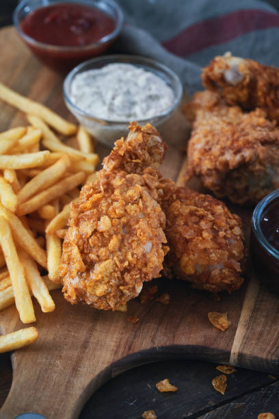 istock Crispy Fried Chicken Drumsticks with French Fries 1492416446