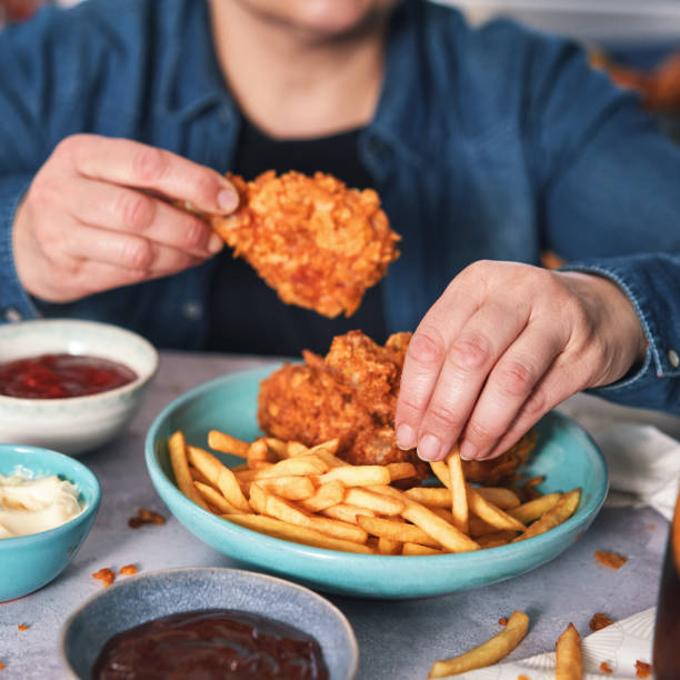 istock Crispy Fried Chicken Drumsticks with French Fries 1492416527