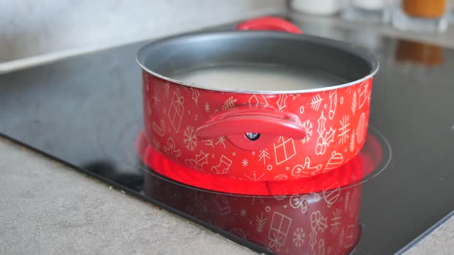 cooking pan on electric stove, electric stove is heated to red.