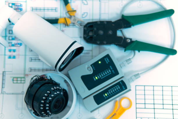 istock Modern white security cameras on the table. The concept of video surveillance installation. 1492419122