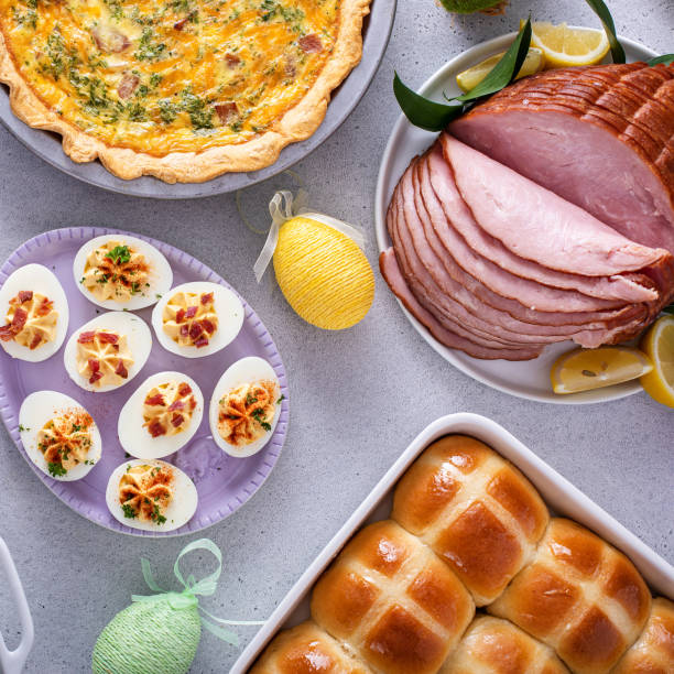 istock Easter brunch table with ham, quiche, hot cross buns 1492419524