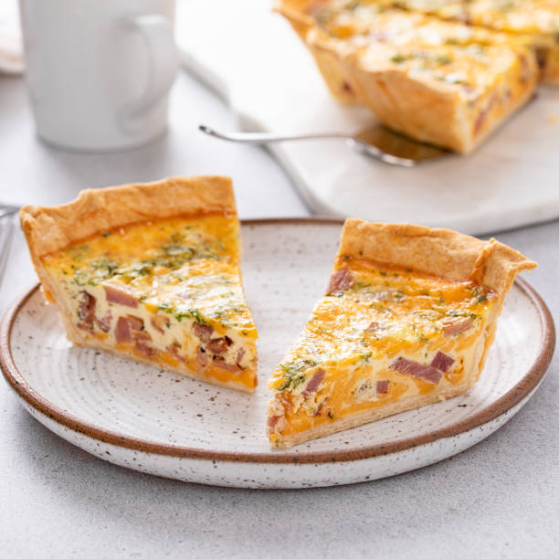 istock Homemade quiche with ham and cheese cut on the table 1492419530