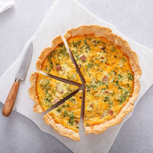 istock Homemade quiche with ham and cheese cut on the table 1492419549