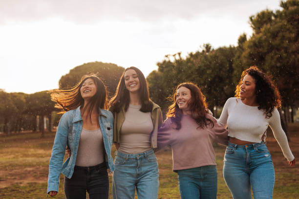 istock Four diverse young girl friends having fun while walking together. 1492420886