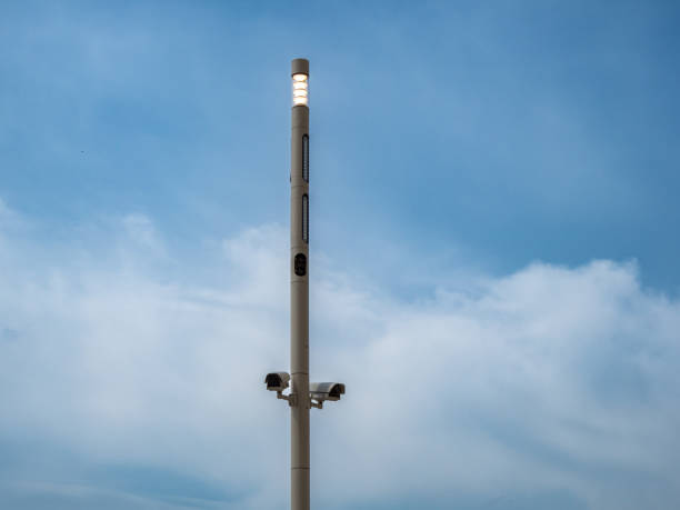 istock Surveillance cameras on a pole against the sky. 1492422766