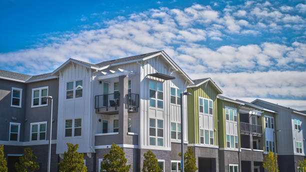 Apartment Buidling Angle view of an apartment building with a cloudy sky flat stock pictures, royalty-free photos & images