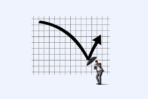 A stock chart reverses course and bounces off an umbrella being held by a man.