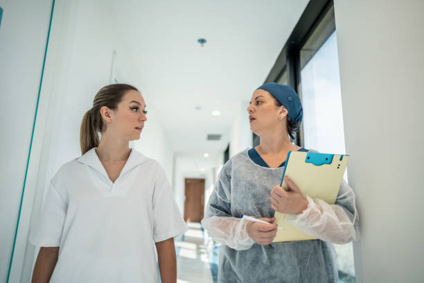 istock Doctor and nurse talking while walking in the hospital 1492429179