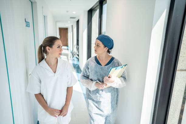 istock Doctor and nurse talking while walking in the hospital 1492430436