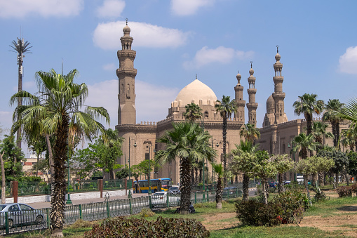 Cairo, Egypt - April 30, 2023: Gardens and Mosque-Madrasa of Sultan Hassan, in the historic center of the city