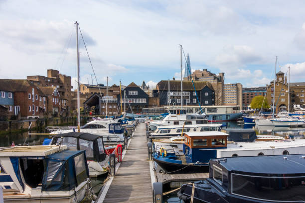 Popular housing and leisure complex with yachting marina in the St Katharine Docks, North Bank of the river Thames, London Borough of Tower Hamlets