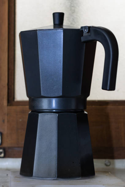 istock Italian coffee maker. Traditional village objects concept 1492435584