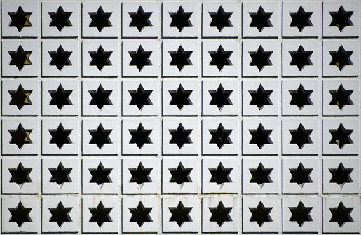 Prefab concrete panel with a pattern of hexagrams / sexagrams / David Stars (Magen David) on squares - backgrounds.