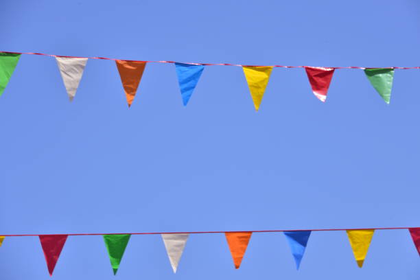 istock Colorful Pennant Banner Flags Against Clear Blue Sky 1492440512