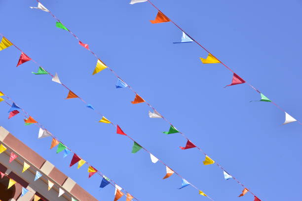 istock Colorful Pennant Banner Flags Against Clear Blue Sky 1492440513