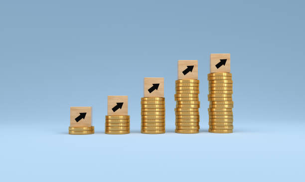 istock Wood cube arrow with coins on blue background, economic data concept, Customer Price Index. 1492441977
