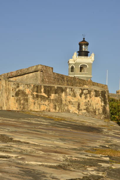 istock Tall Stone Fortification With Tower Against Blue Sky 1492442810
