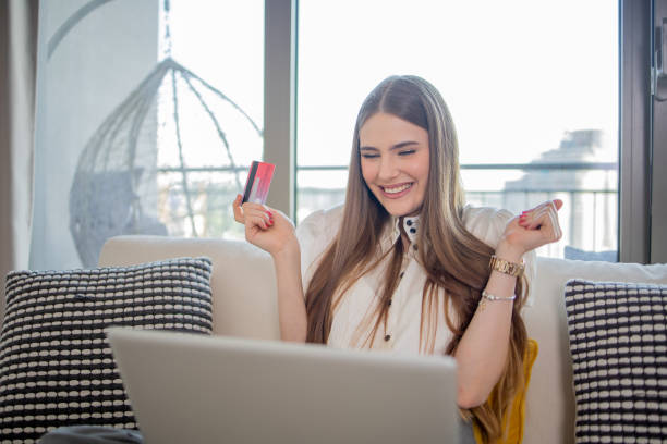 istock Happy young customer enjoys shopping online 1492445009