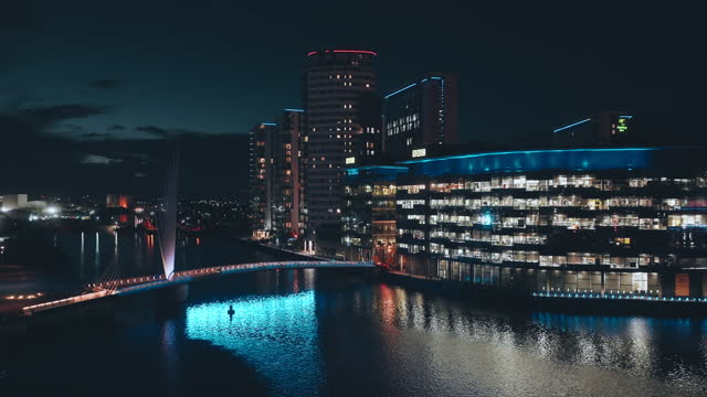 Drone view of Media city Salford quays at night, Manchester