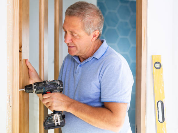 istock A focused middle-aged man using a screwdriver machine on wooden door at home 1492447317