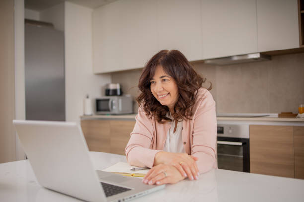 istock Mature woman working from home 1492452415