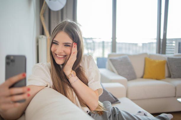 istock Happy young woman using phone 1492456210