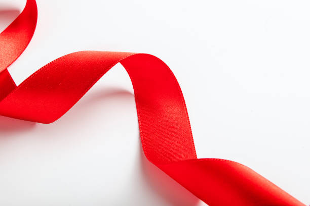 istock Red silk ribbon for wrapping gifts on white background. 1492456577