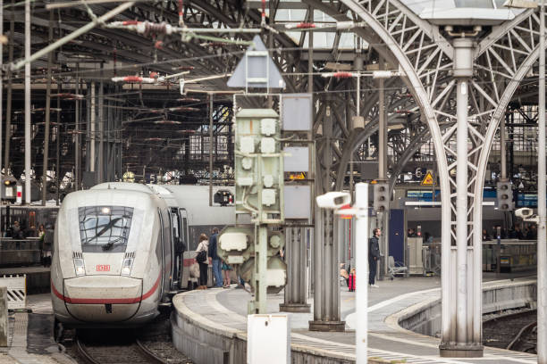 Picture of the main platform of Koln Hbf in Cologne, Germany with an ICE 4 high speed train ready for departure. Köln Hauptbahnhof or Cologne Central Station is a railway station in Cologne, Germany. The station is an important local, national and international transport hub, with many ICE, Thalys and Intercity trains calling there, as well as regional Regional-Express, RegionalBahn and local S-Bahn trains. ICE 4 is a brand name for long-distance Intercity-Express high-speed trains being procured for Deutsche Bahn. Procurement started around 2008 for replacements for locomotive-hauled InterCity and EuroCity train services, and was later expanded to include replacements for ICE 1 and ICE 2 high-speed trainsets.
