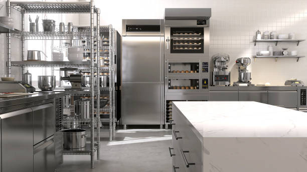 istock Empty clean white marble top island table in commercial, professional bakery kitchen with stainless steel convection, deck oven, freezer, refrigerator, shelf, cabinet, equipment 1492460518