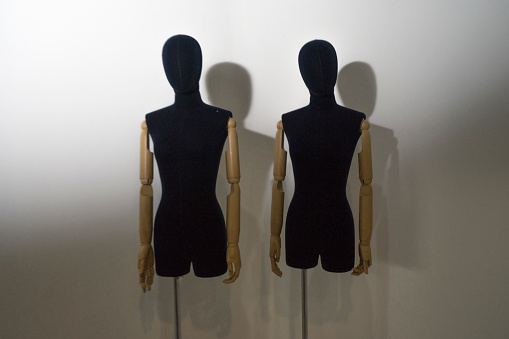 Two mannequins fashion with spotlight shadow