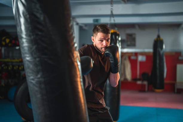 istock Good Looking Male Boxer Exercising And Getting Ready For A Competition 1492469611