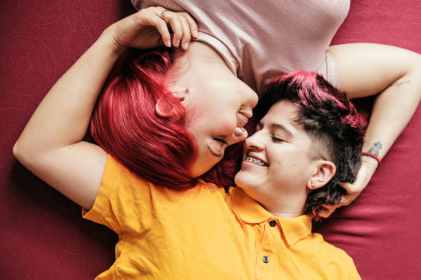 istock two lesbians lying down look at each other with love 1492484744