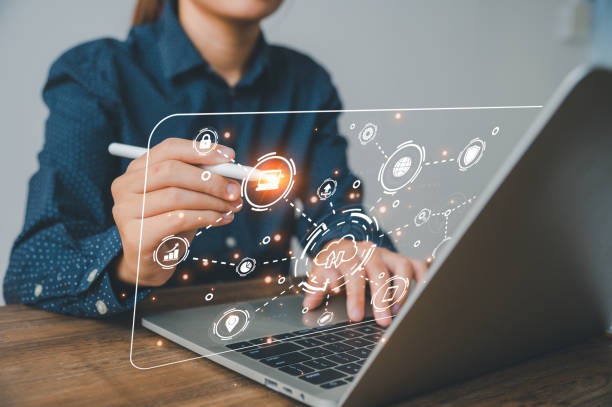 istock Hand holding pen touching computer infographics and technology icons related to data collection such as passwords, banking information. ,personal information 1492485272