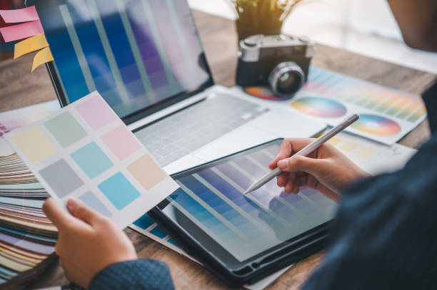 istock Graphic designer architects who work with laptops and color comparison tables for design work. 1492485366