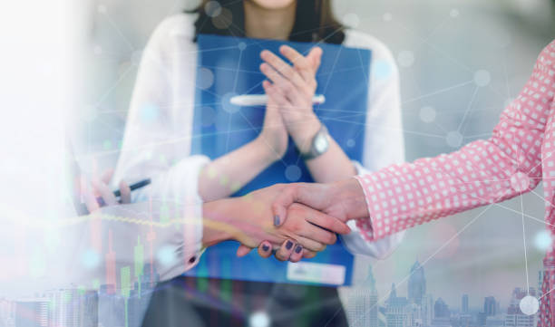 istock business people shake hands showing Trustworthy team work join teamwork,with business futuristic digital interface display, 1492489830