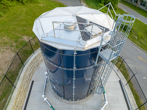 Sewage treatment plant in an industrial district viewed from directly above.