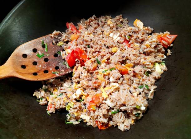 istock Cooking Fried Rice - food preparation. 1492498594