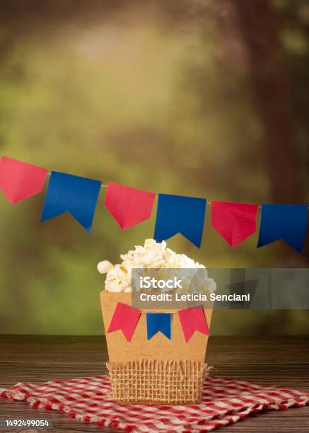 Popcorn In A Festive Setting With Hanging Banners Stock Photo - Download Image Now
