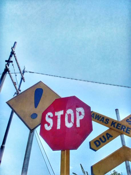 istock Stop sign at a railroad crossing 1492502404