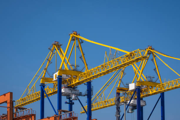 Container cargo ship dock. giant loading or unloading cranes. Container cargo ship dock. giant loading or unloading cranes. gantry crane stock pictures, royalty-free photos & images