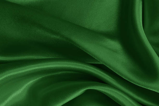 istock Dark green fabric cloth texture for background and design art work, beautiful crumpled pattern of silk or linen. 1492512008